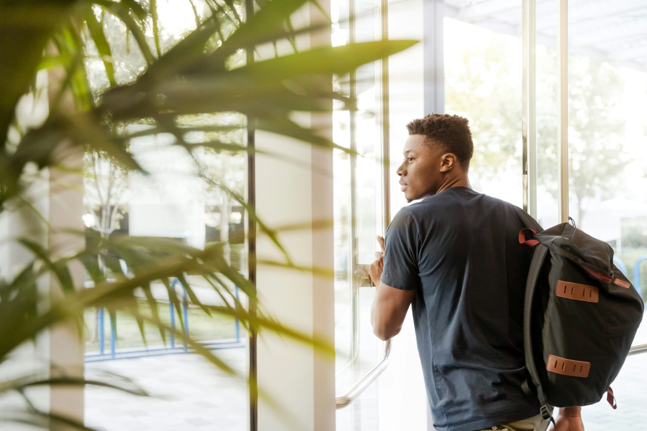 Scholarship student with backpack leaving school