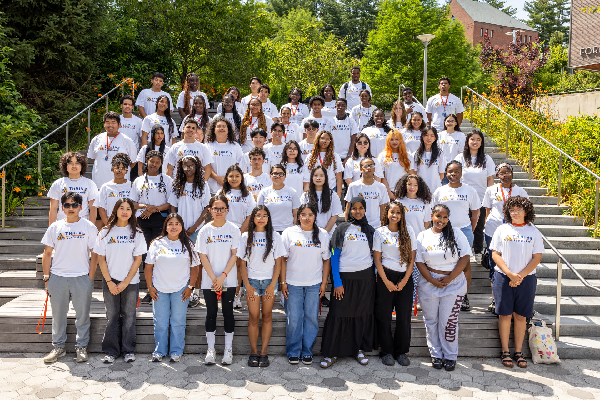 Ensemble of students in Thrive Scholar shirts
